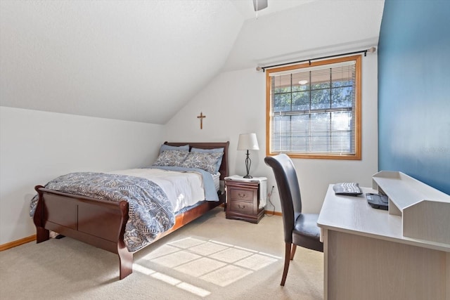 bedroom with light carpet, ceiling fan, and vaulted ceiling