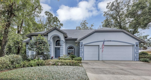 ranch-style home featuring a garage