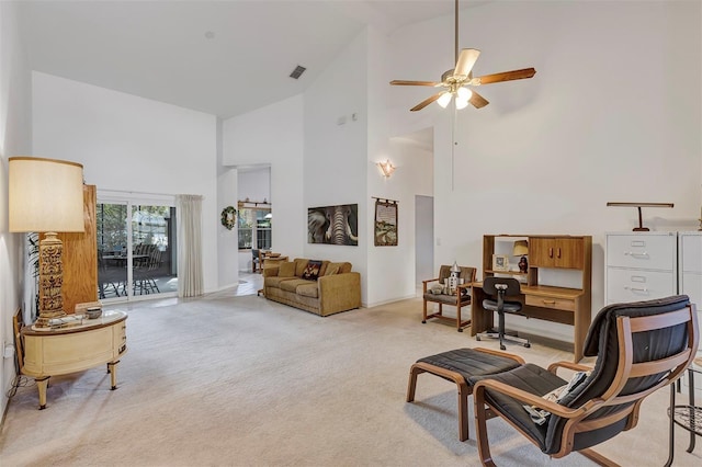 living room featuring light colored carpet, high vaulted ceiling, and ceiling fan