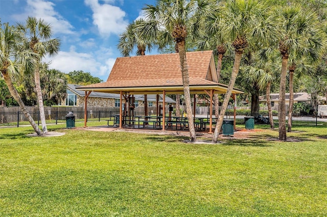 view of home's community featuring a yard and a playground