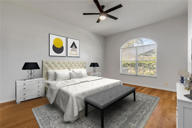 bedroom with ceiling fan and light hardwood / wood-style flooring