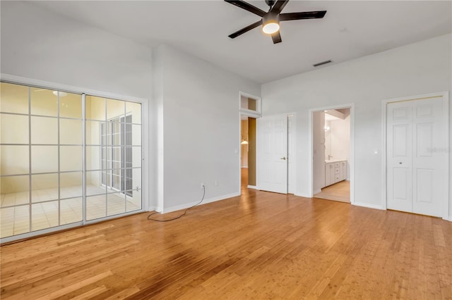 unfurnished bedroom with ceiling fan, ensuite bath, light hardwood / wood-style floors, and access to outside