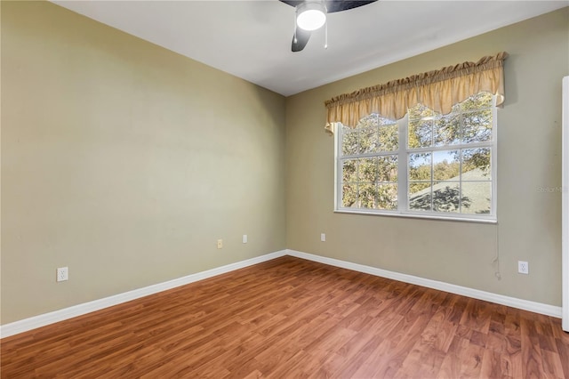 unfurnished room with wood-type flooring and ceiling fan