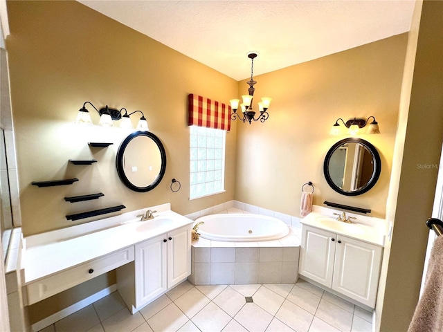 bathroom featuring a chandelier, vanity, a relaxing tiled tub, and tile patterned floors