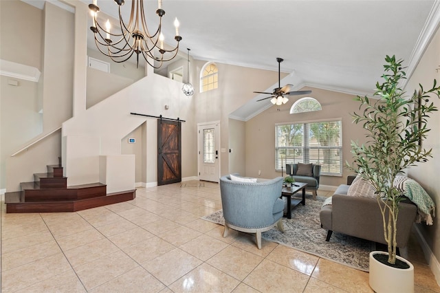 tiled living room with lofted ceiling, a barn door, crown molding, and ceiling fan with notable chandelier