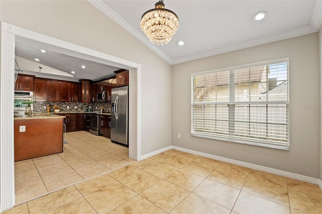 kitchen featuring ornamental molding, stainless steel appliances, light tile patterned floors, a chandelier, and lofted ceiling