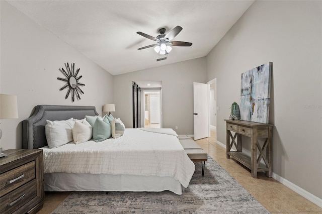 bedroom featuring ceiling fan, light tile patterned flooring, and vaulted ceiling