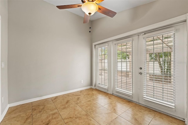 tiled spare room with french doors and ceiling fan