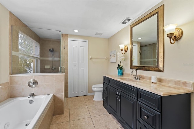 full bathroom featuring tile patterned flooring, vanity, toilet, and independent shower and bath