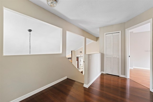 interior space with dark hardwood / wood-style floors