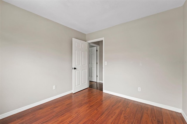 empty room with hardwood / wood-style floors