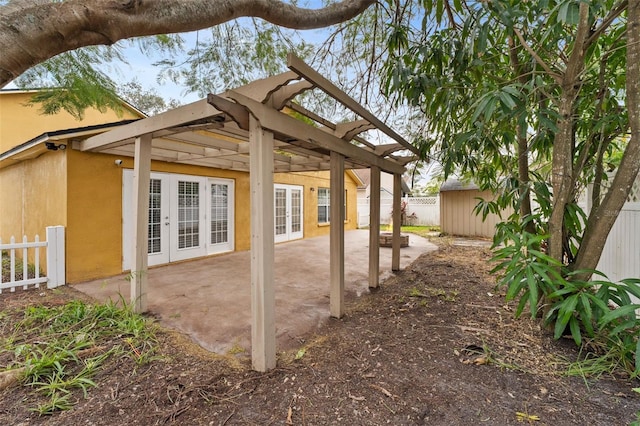 view of patio featuring french doors and a pergola