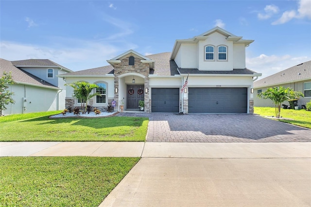 view of front of home with a front lawn and a garage