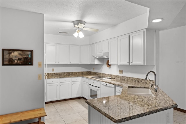 kitchen featuring kitchen peninsula, white appliances, ceiling fan, sink, and white cabinetry