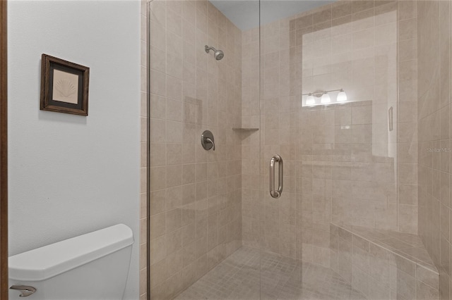 bathroom with walk in shower and toilet