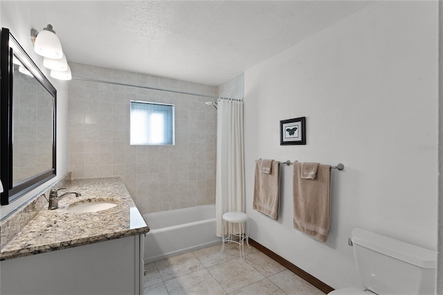 full bathroom featuring tile patterned floors, a textured ceiling, toilet, shower / tub combo with curtain, and vanity