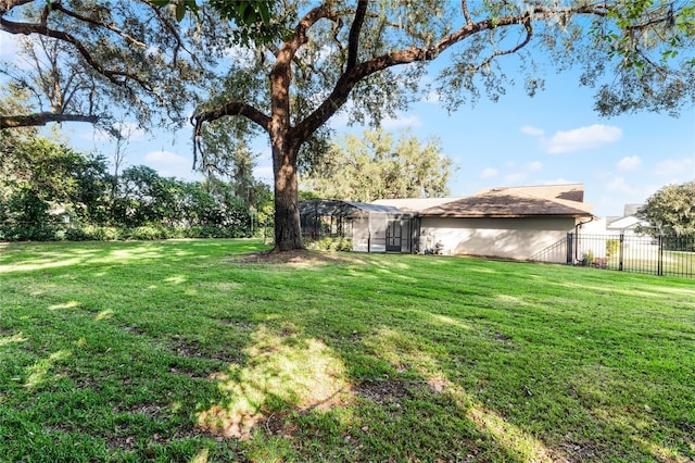 view of yard with a lanai