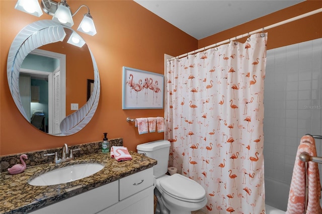 full bathroom featuring vanity, toilet, and shower / bath combo with shower curtain