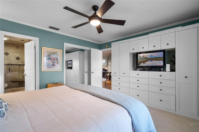 carpeted bedroom with ceiling fan, ornamental molding, and connected bathroom