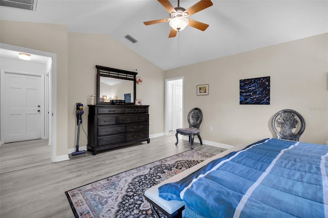 bedroom with ceiling fan, light hardwood / wood-style flooring, and lofted ceiling