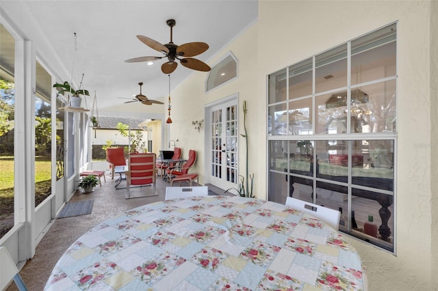 sunroom / solarium featuring ceiling fan