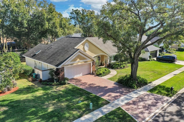 view of front facade featuring a front yard and a garage