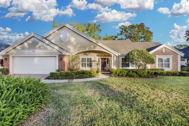 view of front facade featuring a front yard and a garage