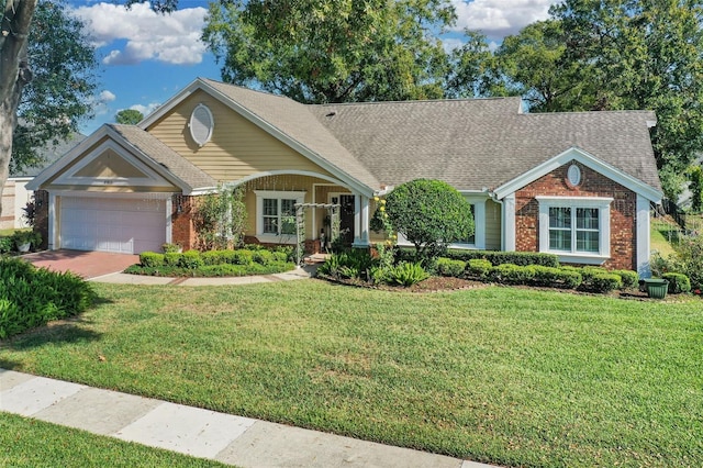 view of front of house featuring a front lawn and a garage