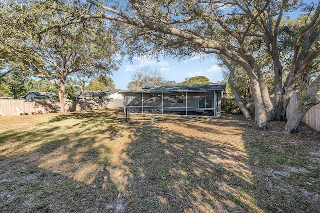 view of yard featuring a sunroom