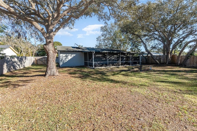 view of yard featuring a sunroom