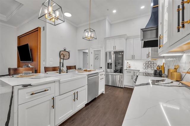 kitchen with stainless steel appliances, hanging light fixtures, white cabinets, and light stone counters