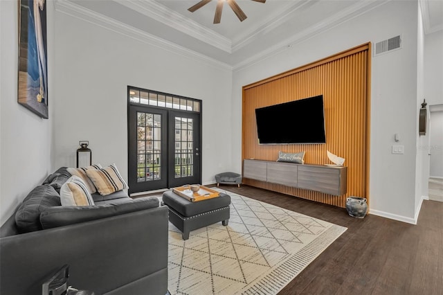 living room featuring french doors, ceiling fan, ornamental molding, and hardwood / wood-style floors