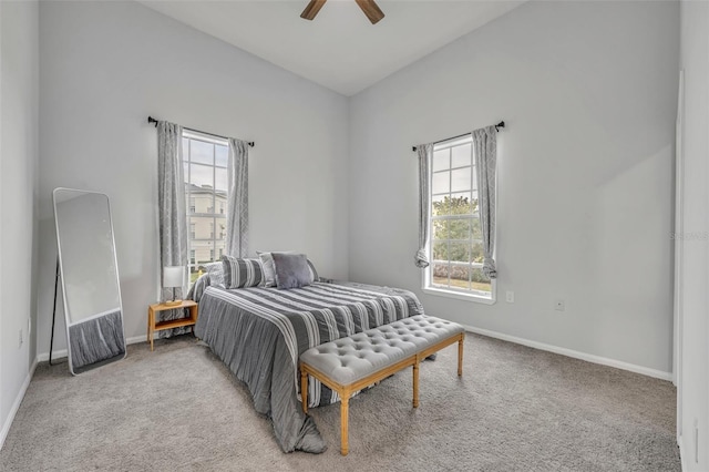 bedroom featuring light carpet and ceiling fan