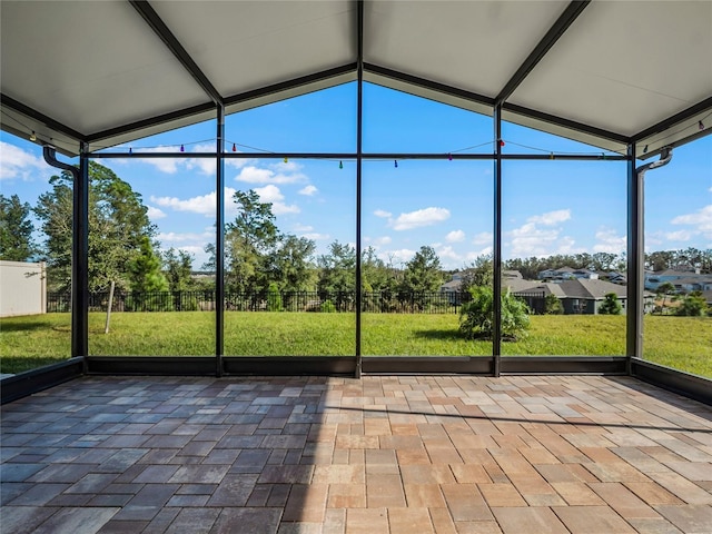 unfurnished sunroom with vaulted ceiling