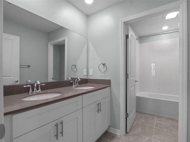 bathroom featuring tile patterned floors, vanity, and bathing tub / shower combination