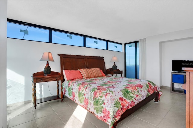 bedroom featuring light tile patterned floors