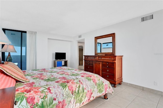 tiled bedroom with access to exterior