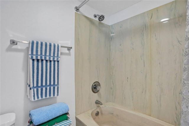 bathroom featuring toilet and bathtub / shower combination