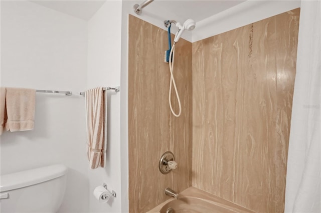 bathroom with shower / bath combination with curtain and toilet