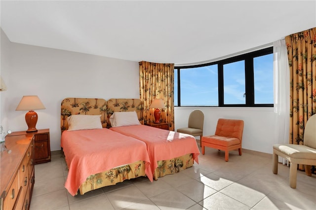 bedroom featuring light tile patterned floors