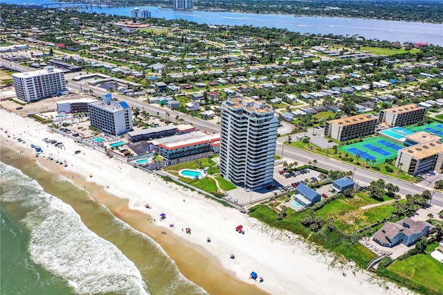 drone / aerial view featuring a view of the beach and a water view