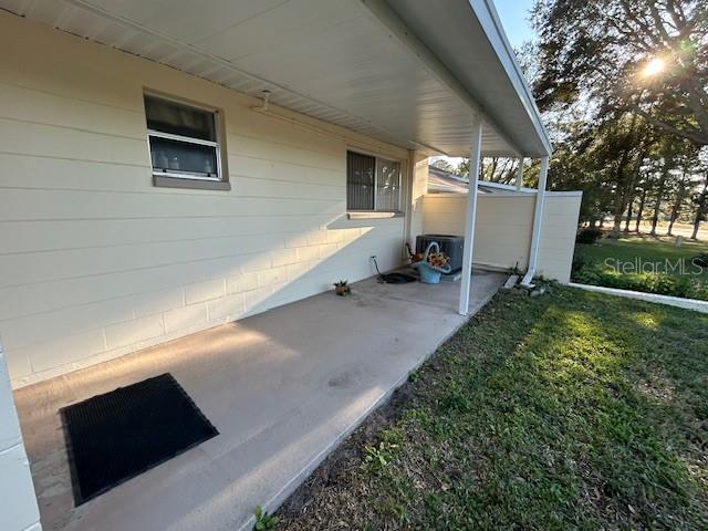 exterior space with a lawn, central AC, and a patio area