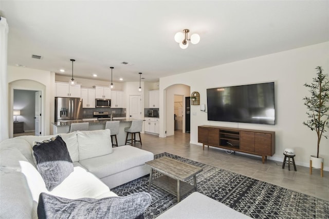 living room with light tile patterned flooring