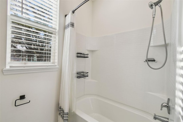 bathroom featuring shower / tub combo with curtain