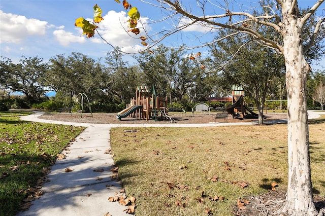 view of jungle gym with a lawn