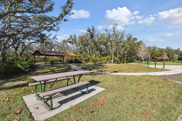 view of property's community with a gazebo and a yard