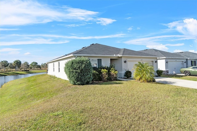 single story home with a water view, a garage, and a front yard