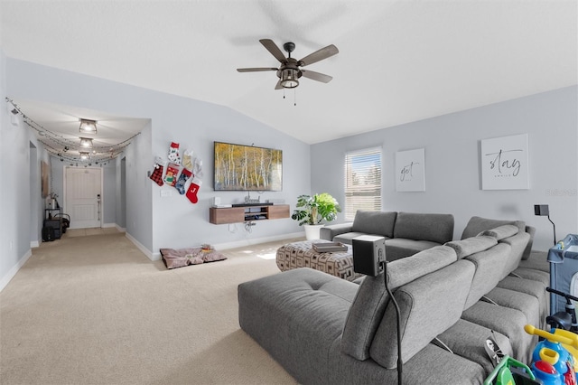 carpeted living room with ceiling fan and lofted ceiling