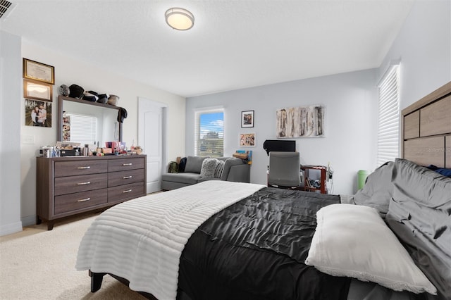 bedroom with light carpet