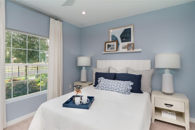 bedroom with ceiling fan and carpet floors